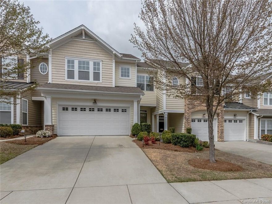 Enjoy this golf course & seasonal water view from your own back patio and deck! This town home features 10 ft ceilings throughout, open layout with upgraded kitchen including SS appliances, granite counters and tile back splash with breakfast bar. Hardwoods on the main and arched doorways. Tray ceiling in Master BR and private deck with spectacular views. Master bath has dual vanities, separate tub/shower, tiled floors & shower and walk in closet. Fresh paint throughout! Home Warranty included.