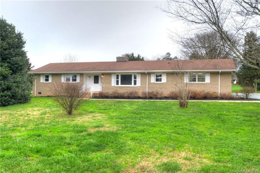 Newly Renovated in sought after Concord.  Home is 4 miles from the Concord Mills Mall & 7 miles to Lowes Motor Speedway. Completely renovated w open floor plan providing many options.  Boasts beautiful hardwoods throughout w bathrooms tiled.  Kitchen: Custom Cabinets, new appliances, granite tops & laundry room off kitchen. Heat/Air brand new w/windows & roof in great condition less than 10 yrs old.  900 sqft outbuilding on 1.5 acres w top schools in the heart of Concord. Please See Virtual Tour