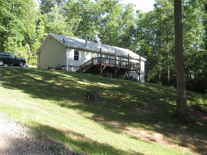 Lovely, well maintained, move-in ready, 1600 square foot home on approximately 2 acres. Like new, off frame, modular on craw space foundation. Split bedroom floor plan, ideal for families.  Enjoy the tranqility and privacy of country living. En suite master bedroom includes an adjoining office.  Huge eat-in kitchen with separate dining room.  Crown moulding throughout the home adds a nice touch. Enjoy the privacy and quiet of the setting on the large front and back decks.