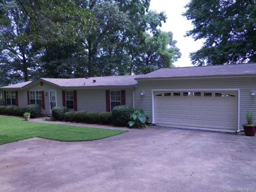 Always wanted a lake home? This manufactured home has been recently painted & is meticulously well-maintained and clean. The kitchen is spacious. The large deck has an unbelievable view of the lake, shady lawn, and covered boat dock. Because the lot has so much water frontage, there is exceptional privacy. The boat dock w/ swim ladder is situated in deep water on a large cove just off the main channel - excellent boating! There is even an outbuilding with WORKSHOP and space for a real MAN CAVE.