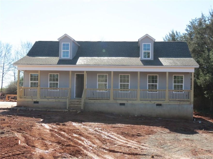 Great setting on a level lot.  This home is stick built with 3 bedrooms and 2 full baths.  Front of the house is a long covered porch that would be great for a swing and rocking chairs.  The back porch is also covered and overlooks the large back yard.  No HOA and country living with the convenience of shopping only minutes away.