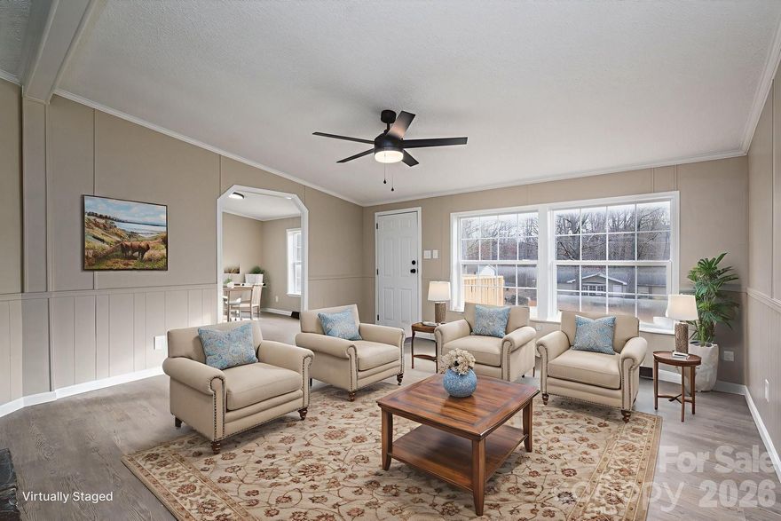 Welcome to a HUGE totally remodeled home with a large backyard ready for its new family!  The home gives a warm and cozy yet clean feel with the warm paint colors, luxury vinyl plank flooring paired with the dark rock fireplace.  The home is listed as a 3 bedroom home due to septic records however the home actually came from the factory with 4 bedrooms and an additional flex space for an office or 5th bedroom.  3 full bathrooms including one jack and jill make for ample room for everyone to get ready at once!  Additional rooms include huge eat in kitchen, formal dining room or den, living room and laundry room.  Also to note are a brand new roof and 3 brand new decks as the house has 3 entrances.  One large deck out back, a front entrance and a side entrance.  The spacious kitchen has brand new white shaker cabinets just as the 3 bathroom do.  Appliances include microwave, dishwasher, electric range and as a Christmas bonus the washer and dryer are included as well!  All kitchen appliances are brand new, washer dryer are approx 3 years old.  Ready to have some more space or a home that has been has been remodeled all at an affordable price?  Look no further!  Make your appointment today!  Right across the Lincoln County line in Gaston County.