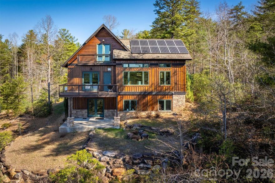 Perched high on the Hully Gully ridge in coveted 1780 on Lake James, this rustic but light and airy hideaway offers one of the rarest combinations anywhere on the lake—sweeping long-range water and mountain views. Surrounded by mature hardwoods and natural beauty, the setting feels worlds away while connecting you directly to miles of community trails that meander through conservation land and lead directly to a beautiful, waterfront gathering area, Hully Gully Pond, and Camp Lake James—membership included with purchase.  It also connects you to miles of trails including the Overmountain Victory Trail, Lake James State Park trails, and future sections of the Fonta Flora Loop trial.  Though modest in footprint, this thoughtfully designed three-story home lives large, offering multiple gathering areas and plenty of room to spread out or host guests. Privacy, serenity, and endless recreation come together in this remarkable ridge-top retreat. Short-term rentals are permitted, making this both a peaceful escape and an exceptional investment in one of Lake James’s most sought-after locations.