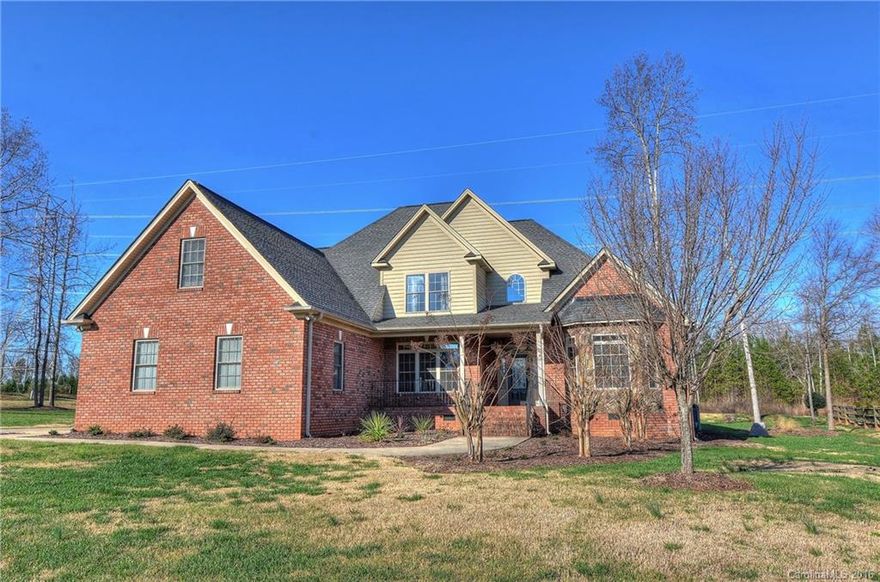 Awesome floor plan! Main level includes a soaring vaulted great room w/ stone frpl, elegant DR, designer kitchen, keeping room w/ 2nd frpl, study, full bath and master retreat! Gorgeous hardwoods, heavy moldings, lighted ceiling fans & great storage including big walk-in attic. Bonus/4th BR has neat wet bar & powder room. Screened porch & patio overlook nice level yard - 1 acre corner lot w/ side load 3-car garage & additional parking. Minutes from shopping, dining, Lake Wylie access!