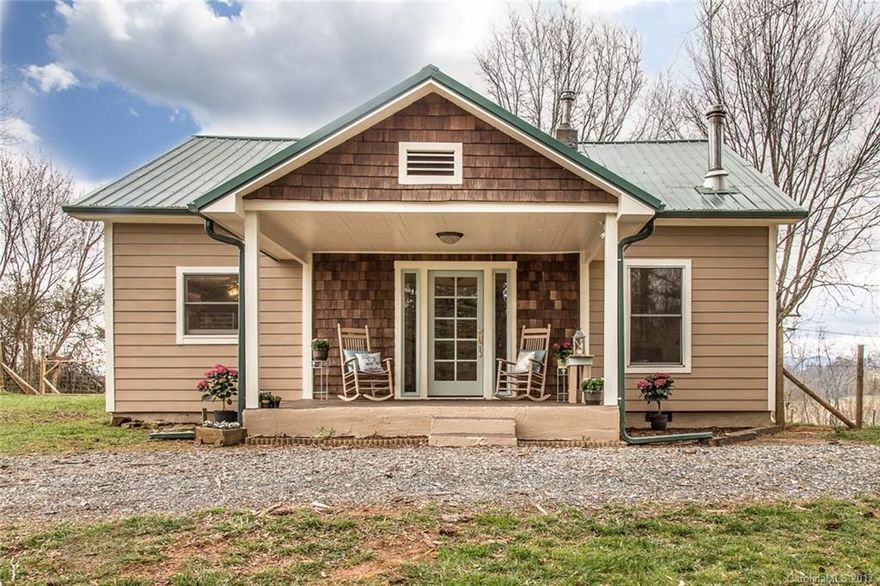 Fall in love with this picturesque farmhouse in a storybook setting. Two bedrooms on main with two additional bonus/ bedrooms upstairs. Gorgeous original hardwoods throughout with brand new carpet on stairs and upstairs bonus room. Open, bright kitchen and dining room with a wall of windows looks out onto fenced-in backyard with fruit trees and magnificent long-range mountain views. This home offers the perfect mix of privacy and peace with neighbors nearby making it cozy and warm.