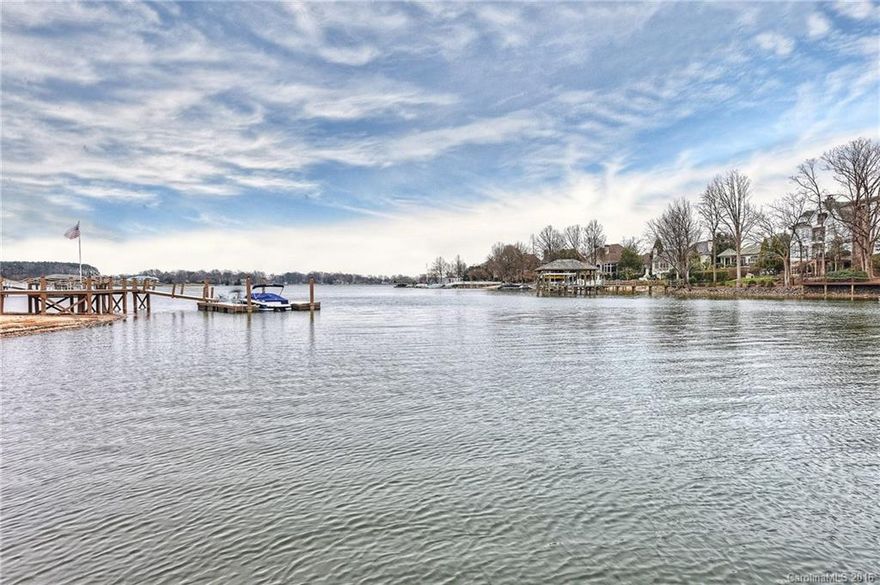 Peaceful Lake Norman waterfront estate updated in a timeless classic style. Lakeside great room has coffered ceiling, Travertine fireplace & custom cabinetry. Gourmet kitchen with expansive island,professional grade appliances including Viking 6 burner gas stove,double ovens,warming drawer.Master suite with new bath features Carrera marble, soaking tub & oversized shower.Upper level media room complete with projector & bar.Covered slate veranda, lakeside fire pit & covered pier for entertaining.