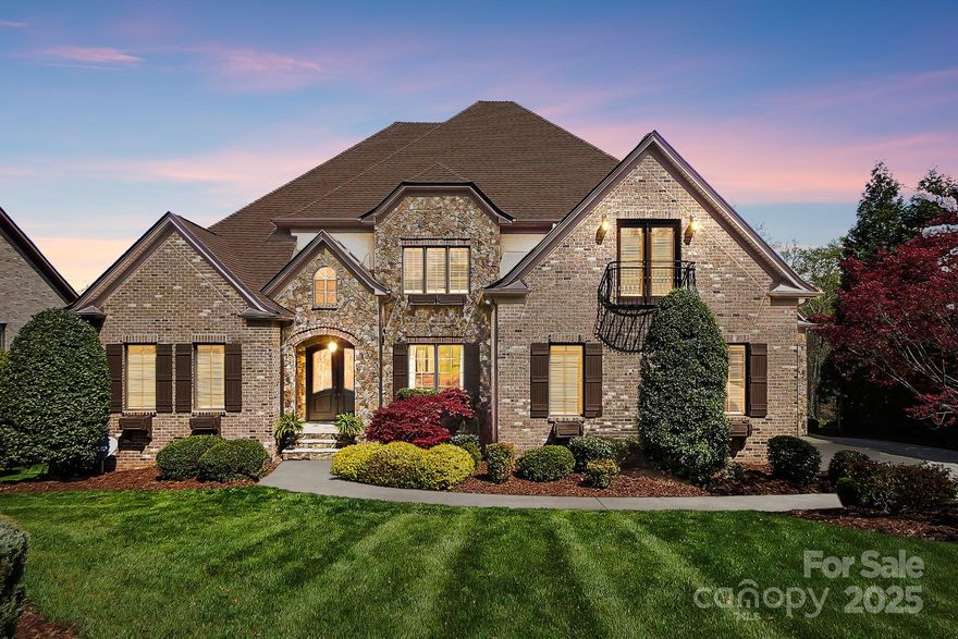 PROVIDENCE DOWNS SOUTH PERFECTION! Gated luxury meets comfort + style in this PDS masterpiece. This elegant, thoughtfully updated primary-on-main STUNNER boasts a walkout basement, soaring two-story entry & exquisite craftsmanship throughout. Stacked stoned arches, coffered ceilings, grand fireplaces & hardwood floors impress. The chef's kitchen is an entertainer's dream with white quartz counters, 6-burner Thermador stove, double Bosch dishwashers & professional grade fridge...all flowing seamlessly into the dining & living spaces w/ pool views. The main-level owner's suite is pure luxury with screened terrace access, wet bar, custom closet with laundry & spa bathroom. The walk-out basement stuns with 10-foot ceilings, full kitchen, second primary suite, home theater & bright home gym. Upstairs, find three ensuite bedrooms plus bonus room. Systems & roof all recently replaced. Set in one of Charlotte's most exclusive, amenity rich communities, this is the home you've been waiting for.