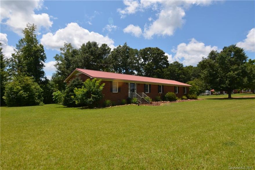 This adorable freshly painted brick ranch is located in the Clover School District and has 2 bedrooms and 2 full baths with NEW flooring throughout it. Not a fan of the cold? No worries! Your new home has a beautiful gas burning fireplace to keep you nice and warm! Quietly sitting on 6 fenced in acres complete with a barn and pond, the possibilities are endless!!