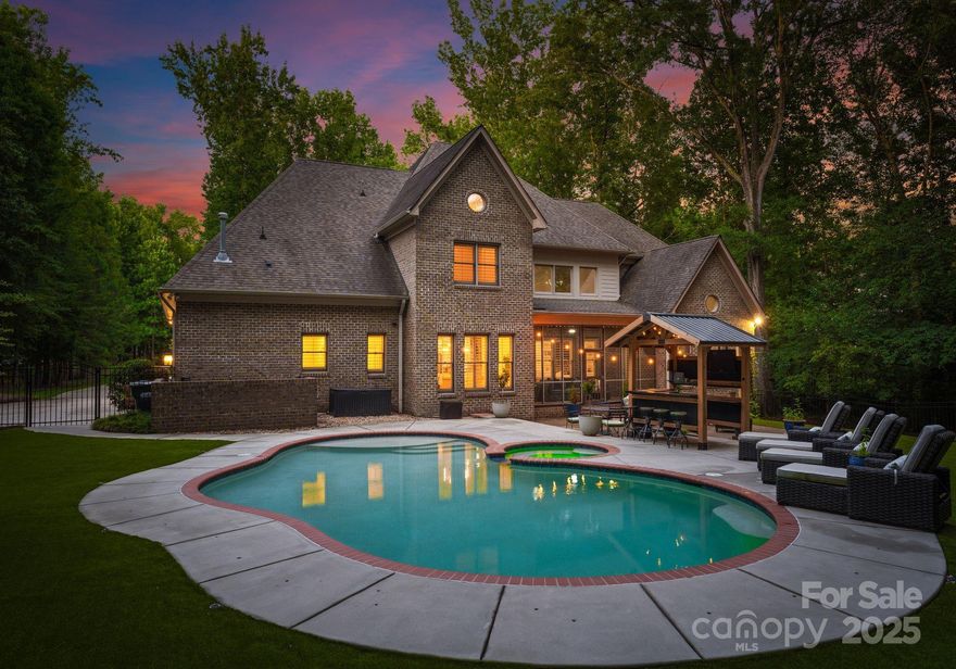 Experience unparalleled luxury in popular Weddington where resort-style living meets the serenity of nature. This beautifully crafted home is designed to impress at every turn.Chef’s kitchen is a true showstopper tastefully updated with high-end SS appliances,new gas cooktop & designer lighting that elevates every detail.Elegant porcelain floors add a refined touch,complemented by soaring 10 ft ceilings,plantation shutters & stunning custom stonework stretching from the fireplace to the vaulted ceiling, creating a dramatic focal point!Expansive primary suite is a true retreat,with a spa-inspired bathroom & walk-in closet.Step outside to a screened-in patio that opens to your own backyard oasis complete with a heated saltwater pool, fully equipped cabana & built-in grill perfect for entertaining guests or enjoying quiet evenings under the stars. Surrounded by lush landscaping & nestled in one of Weddington’s most desirable communities, this home redefines luxury living.