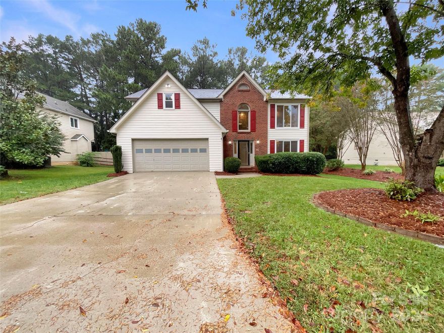 Seller may consider buyer concessions if made in an offer. Welcome to a beautifully updated property where modern comfort meets timeless style. The interior features fresh neutral paint and a cozy fireplace that adds warmth. The kitchen is a chef's delight, with an accent backsplash and new stainless steel appliances. The primary bedroom offers a spacious walk-in closet, while the primary bathroom is designed for relaxation, featuring a separate tub and shower, as well as double sinks. New flooring throughout enhances the fresh feel. Outside, enjoy a deck and covered patio, perfect for entertaining or quiet relaxation. This property is a true gem, ready for you to take it home.