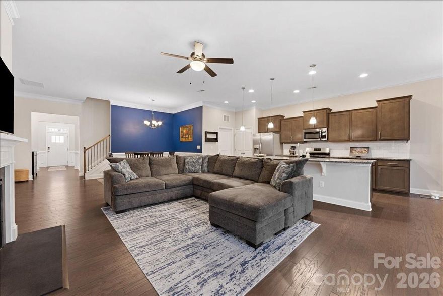 Perfectly positioned near the end of the street & in the back of the established Riverbend community, this well maintained 4-bed/3-bath ranch home offers a functional layout with modern living. The open concept design centers around a gourmet kitchen featuring bold Caledonia granite, Benton burlap cabinetry, stainless appliances, a gas range/oven, & an oversized island that flows into a spacious great room with gas fireplace. Tall ceilings throughout the main floor & crown molding add a refined touch, while the dining & breakfast areas make everyday living & entertaining easy. The main level owner’s suite provides a peaceful retreat with tray ceiling, a luxury tile shower, & a large walk-in closet. All primary & guest baths are finished with granite countertops & tile floors for a cohesive, upscale feel. Upstairs, a loft, 4th bedroom, & full bath offer flexibility for guests or work from home space. Step outside to a large tiered stamped concrete patio spanning the full width of the home & enjoy the tree-lined backyard. Convenient to grocery/dining/pharmacy, the U.S. National Whitewater Center (6 miles), Uptown Charlotte (11.6 miles), downtown Mount Holly (6.3 miles), & the CLT airport, this amenity-rich neighborhood includes a pool with waterslide, playgrounds, lit sidewalks, and reasonable HOA dues.