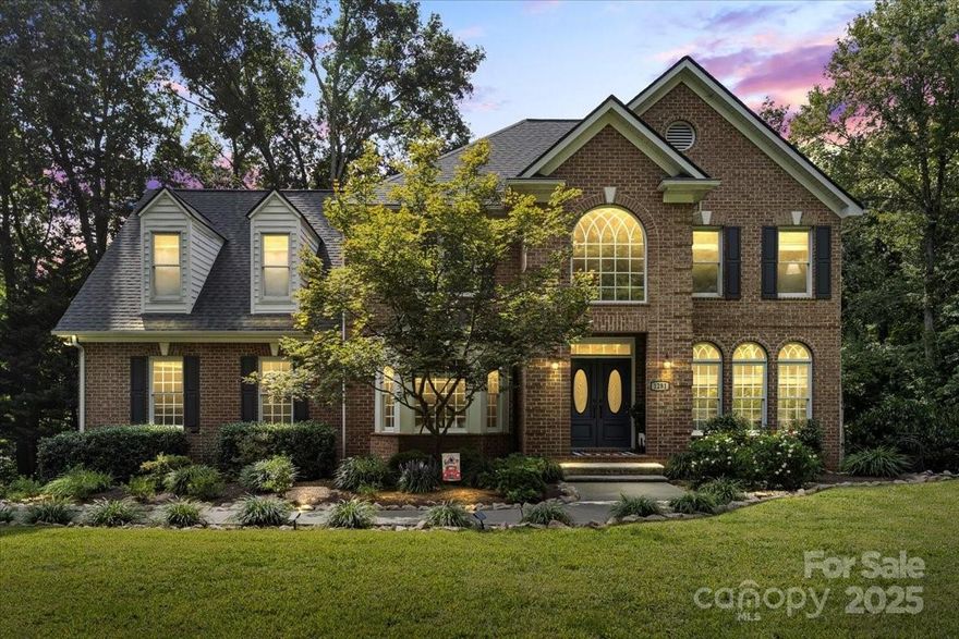 A rare Fort Mill find: this home sits on three wooded acres with a private pond and the freedom of no HOA, all just minutes from everywhere you want to be.

And that’s only the beginning. Offering nearly 4,900sqft of living space, this Fort Mill home showcases striking architectural details throughout, from a soaring two-story foyer with tiered tray ceiling to the vaulted, light-filled sunroom, and the dining and kitchen ceilings finished with intricate tile accents. Parquet flooring and a double staircase set an elegant tone, while open living areas blend entertaining with everyday comfort.

Upstairs, the primary suite continues the theme with a dramatic multi-level tray ceiling, custom millwork accent wall, and an extended retreat area for added style and sophistication. The luxury bath, updated in 2022, includes a walk-in shower and plumbing ready for a corner soaking tub if desired. A large walk-in closet with built-in drawers provides ample storage. Three additional spacious bedrooms and a refreshed hall bath complete the upper level.

The kitchen combines timeless design with thoughtful updates, solid-wood cabinetry, granite countertops, stainless appliances including double ovens and gas cooktop, a generous peninsula with seating, and a breakfast area with custom built-ins that create a perfect coffee nook. Also on the main level: a large sunroom with walls of windows, a family room with gas fireplace and built-ins, a formal living room with arched transoms, and a spacious dining room with bay window.

The finished basement impresses with high ceilings and flexible spaces for work or play, including a home theater, expansive office with built-in desk and walkout access, exposed-brick flex area with dog run, full bath, and abundant storage with a large utility room.

Outdoor living takes center stage with a main-level deck for grilling and relaxing, a lower patio, above-ground pool with surrounding decks, a private pond, treeline privacy in every direction, and access to wooded trails along the creek. The property line even extends beyond the street, preserving wooded privacy out front.

Recent Updates: tankless water heater (2025), garage doors/motors/smart openers (2025), architectural shingle roof (2024), main level & basement HVAC system (2022), dual air/UV purification systems (installed 2018, bulbs replaced 2022), well bladder (2025), whole-home water filtration (2024), and more.

This exceptional Fort Mill, SC property blends privacy, character, and modern comfort, truly a one-of-a-kind retreat.