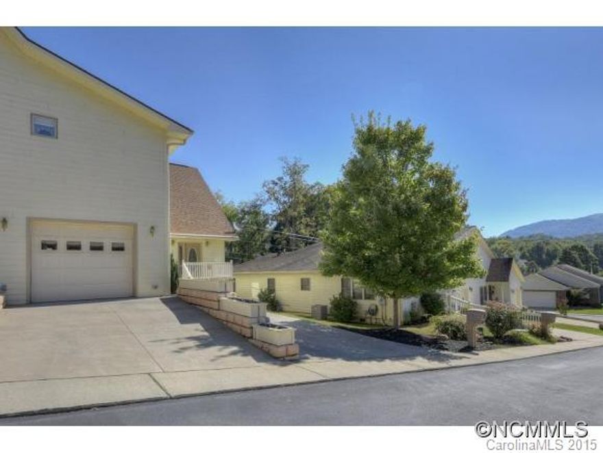 PRICED BELOW TAX ASSESSED VALUE: Wonderful Townhome within walking distance to downtown Waynesville and the convenience of shopping and entertainment. Beautiful maple cabinets, cathedral ceiling living room with fireplace, spacious kitchen with breakfast bar, master bedroom on main floor and many other fine features. Main entry level access can be obtained through spacious single car garage.