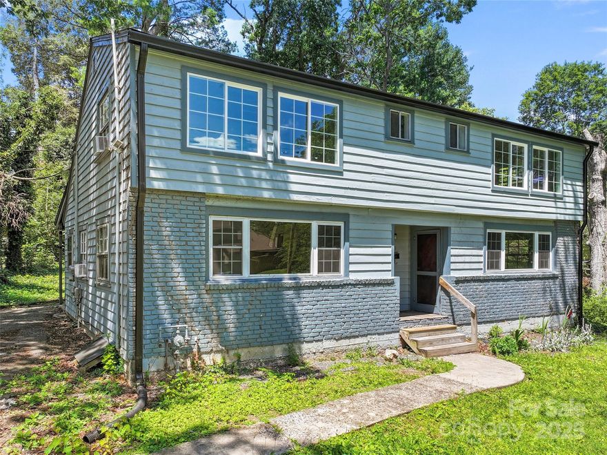 Set on a spacious .32 acre lot, this classic duplex in Asheville’s sought-after 5 Points neighborhood offers endless potential. Located a short distance to downtown, UNCA, greenways, dining, shopping, and more, the lifestyle and location can’t be beat. The duplex is ready for your personalizations and updates, making it an ideal candidate for an investor, house hack, or a live-in renovation. Each unit features a 2 br / 1 ba floorplan that allows in bright natiural light. Downstairs offers the kitchen, living room, and a bedroom, and upstairs offers a full bathroom and bedroom. The unfinished basement offers space for storage and tenant laundry hookups. A large front yard, outdoor living potential in the rear, off-street parking, and a welcoming front porch add to the charm of this rare duplex opportunity. Potential to subdivide flag lot in the rear of the property. Bring your ideas and creativity—this duplex is ready for transformation to create significant long-term investment value!