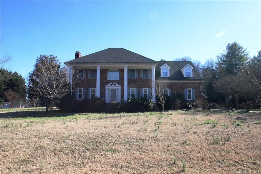 2 Story Full Brick on approx 1 acre.  3 Bedrooms and 2.5 baths.  Huge master suite with tray ceilings, huge master bath with vaulted ceilings, oversized garden tub, separate shower and a walk in closet to die for.  Also, a huge recreation room on the second floor with a wet bar.  Tons of storage and closet space throughout. Very spacious living areas and kitchen. Fireplace in the den.  Screened in porch, irrigation & more.  Attached 2 Car & detached 2 Car Garages.  Fron & Back Stairs! Needs TLC