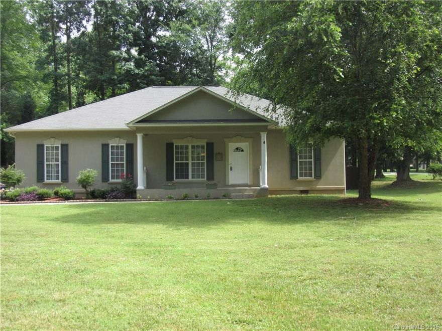 Large Corner Lot Ranch with Fenced Yard. Move in ready with open floor plan. Split bedroom plan. Side load attached two car garage. The kitchen has a serving island and corian countertops. Don't miss this one!