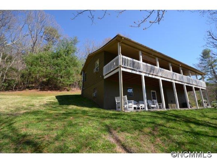 Every mechanic, or cabinet maker or DIY has dreamed of a workshop like this. Water and electricity and a 1000 sq. ft. The house is immaculate and well built with 2 covered porches to enjoy long distance view in fall and privacy in the summer. Upstairs of barn was designed for apt. but not finished. Entry on ground level from upper driveway.  Perfect for elderly parents. Huse has spacious kitchen with bar and eat in area. Above ground basement