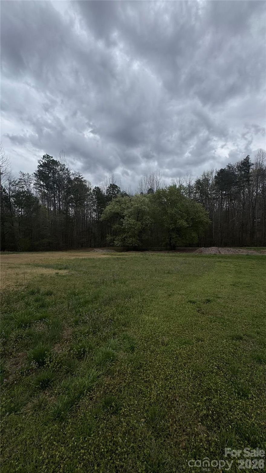 Great opportunity to own 2.54 acres in Gastonia! This spacious lot, located on Lewis Rd, offers plenty of room to build your dream home while enjoying privacy and natural surroundings. The property provides a peaceful setting with convenient access to nearby shopping, dining, and major roadways, making it easy to reach both Gastonia and the greater Charlotte area. With over two acres of land, there is ample space for a custom home with large outdoor living. Don’t miss this chance to own a large parcel in a growing area with great potential. Back on the market due to buyer termination. Land was under agreement; however buyers did not complete a perc test or obtain septic permit prior to withdrawal. No fault of the seller or the property. Buyers are encouraged to perform their own due diligence regarding soil testing and septic approvals