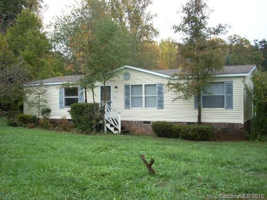 Location big plus. Near airport, freeways. Behind quiet suburban neighborhood in rural setting so no HOA. large lot. doublewide needs some TLC inside and priced accordingly.