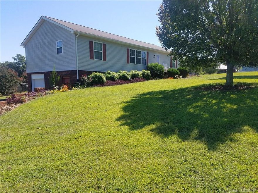 Desirable ranch with acreage. Beautiful views in every direction. Home has large living room, separate dining with French doors that lead to spacious deck. Kitchen has ample cabinetry and counter space.Split bedroom plan, master has large closet, extra vanity storage for linens. Basement has full garage door with separate driveway entrance. This is an off frame modular and was engineered for a full basement completion with high ceilings and central steel beam. Plumbing is roughed in in basement.