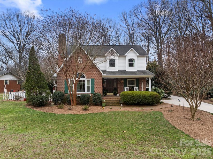 This custom-built home is a rare opportunity in one of Kannapolis’ most established and convenient neighborhoods; just minutes from I-85 and vibrant downtown Kannapolis.

Thoughtfully designed and meticulously maintained, the floorplan simply makes sense. The primary suite is privately tucked on the main level just off the kitchen, featuring vaulted ceilings, custom built-ins, a spacious walk-through closet, and a large ensuite bath with a whirlpool tub.

The recently updated kitchen is built for gathering, offering quartz countertops, soft-close cabinetry, a gas cooktop, double ovens, and seamless flow into the breakfast area and adjoining living space. Whether hosting holidays or enjoying casual evenings at home, this layout delivers. A dedicated laundry and mudroom with sink and cabinetry adds everyday functionality.

Formal dining overlooks the side garden, while tall ceilings and custom built-ins in the living room provide warmth and architectural character. A main-level guest bedroom sits beside a full bath, ideal for visitors or flexible use.

Upstairs, you’ll find three spacious bedrooms and two full baths, each with generous closets. A walk-in attic provides exceptional storage, and a bonus room(currently used as a ping pong room not pictured) adds even more versatility.

The side-entry garage is thoughtfully positioned at the rear of the home, preserving curb appeal while offering additional square footage so it never feels cramped, with ample room for vehicles, storage, and hobbies.

An adjacent lot is available for purchase with the home or will be offered separately, presenting a rare opportunity for expanded privacy or future possibilities.

Custom, established, and exceptionally located... homes like this rarely come available.