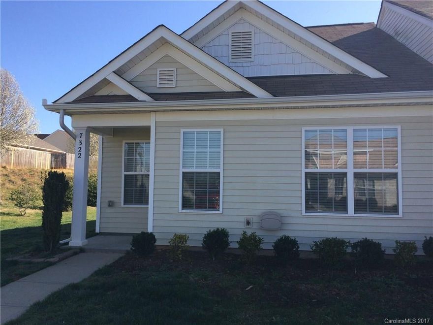 Beautiful end unit townhome with hardwood floors, new carpet, stainless steel appliances and an enclosed patio! Move-in ready and available now! Use of community pool is included with the monthly rent!