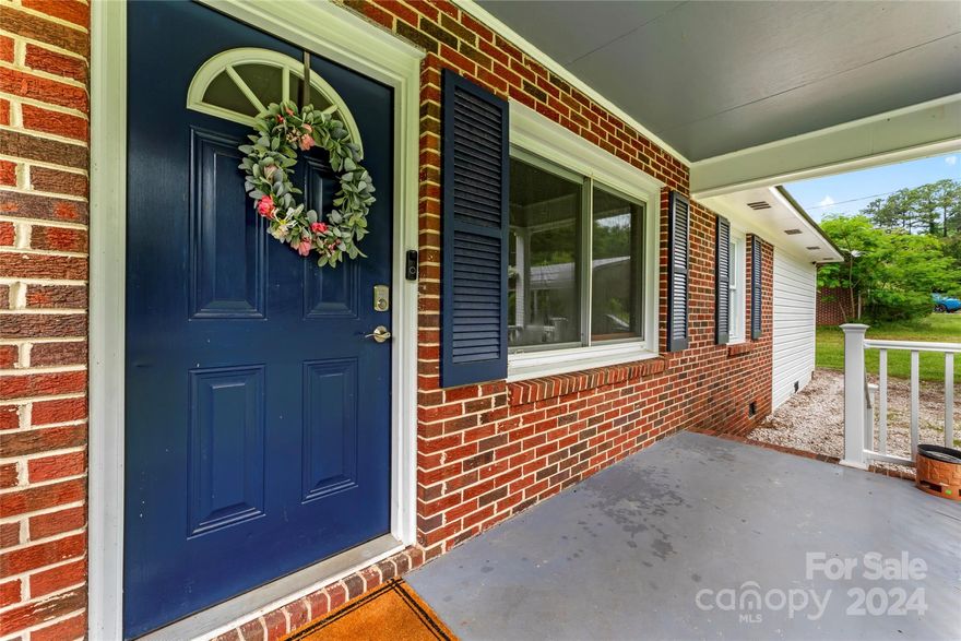 This charming 3 bedroom, 1.5 bath brick ranch is move-in ready with a 1/2 arcre lot!  Enjoy your open living area that flows into a great sized bonus room - absolutely perfect for an office or playroom. The kitchen has white kitchen cabinetry and stainless steel appliances. Enjoy entertaining your guests this summer in your large, flat yard, partially fenced-in. Low maintenance with new roof in 2024! This property is only 3 miles to the river and Fishing Creek boat landing! Experience the beauty and tranquility of Fort Lawn while still having convenient access to Rock Hill, Fort Mill, and I-77. Don't miss this fantastic opportunity to live in a peaceful, rural setting with easy commutes to the city!