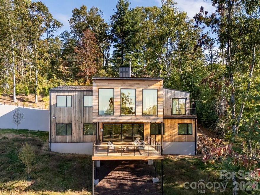 Elk View is a community of 25 environmentally conscious mountain homes with long range views. An undercurrent of creativity is an ingrained part of the fabric of Asheville. Every house is designed with a goal of netzero-carbon emissions, and constructed with local, pre-fabricated and low-embodied carbon materials. The homes are guided by Passive House design principles, like airtight insulation, to increase indoor air quality and decrease energy bills. Each will feature all-electric building operations, and will be built from local resources with local craft.  From a design standpoint, each home is a singular work of architecture with a special identity that responds to the specific contours of its surrounding landscape. The interiors are designed with crisp, muted tones to balance with the striking nature just outside. Homes are complete with handmade finishes, locally sourced white oak floors, and multi-use spaces to create an escape within an already meditative landscape.
This home is engineered for exceptional health and energy efficiency, featuring continuous 24/7 filtered fresh air, MERV-13 and photocatalytic purification, and an Energy Recovery Ventilation system for outstanding indoor air quality. The high-performance thermal envelope and ultra-efficient HVAC system come with a lifetime, transferable energy-use guarantee, and a proven reduction in long-term utility costs.