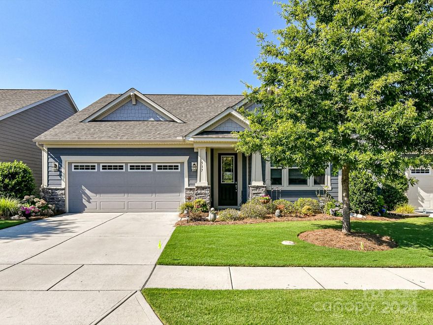 Absolutely stunning home in sought after Cadence in Tega Cay! You'll be impressed with this well-maintained home! A home office flanks the foyer as you enter the home. The elegantly appointed kitchen offers custom cabinets, wood hood, beautiful granite, large subway tiles, farmhouse sink, gas cooktop and a huge walk-in pantry.  The family room, dining and kitchen are all situated in an open floorplan, and all tied together with LVP flooring. The primary is located on the main floor with an amazing walk-in shower and a large closet that has direct access to the laundry room. The home also features two more additional bedrooms, one also located on the main floor and one upstairs with a massive bonus room. Wait until you see the back yard with an impressive, covered patio and retractable awning. This is one you really should hurry to see, it's gorgeous!