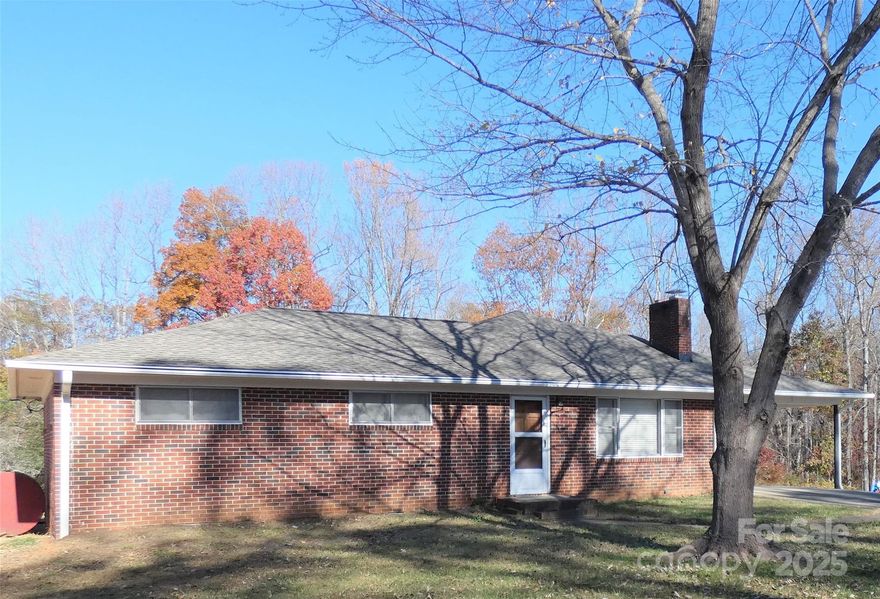 Unique property in West Iredell. Nine+ acres featuring beautiful trees and a creek. Ranch style home with abundant living space. Home can be lived in as is and updates made later on. Roof was replaced in 2023. This property has a detached two car garage: 24'x24' and 10'x15' outbuilding. Well on property has not been used since switching to county water. Hardwood floors in the living room, hall and all bedrooms. Spacious kitchen and dining area with tons of storage. 220' of road frontage on Fonda Lane.