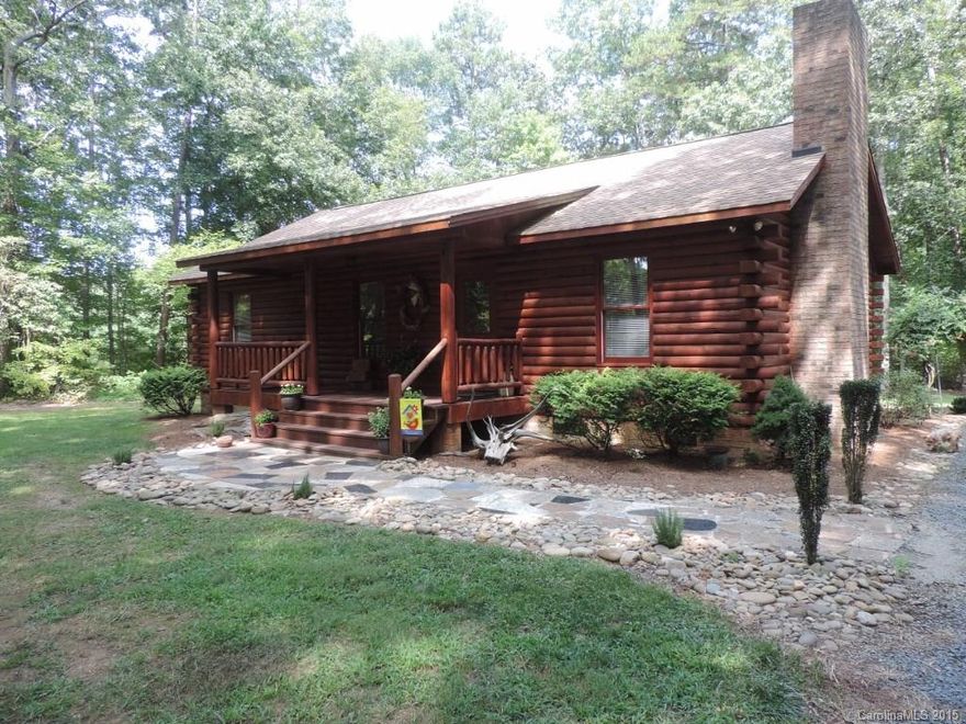 Beautiful Log home in a private country setting! This home sits back off the road on 2.5 acres. It has custom oak cabinets, rock fireplace, outdoor fire pit, large deck, oversized doors throughout the home, new laminate flooring plus much more. Sellers are also willing to convey some of the furniture. Come check this one out!!
