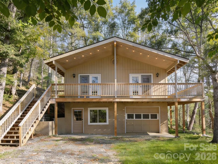 Tucked just above beautiful Cane River, this easy-going mountain retreat is all about privacy, comfort, and mountain views. Set on a private, tree-lined lot, you get that peaceful “away from it all” feeling without actually being far from anything. Inside, the open living space is bright, welcoming, and anchored by a cozy wood-burning fireplace that feels like home from day one. The kitchen flows straight out to a brand-new oversized deck perfect for morning coffee, sunset wine, or hosting friends after a day in the mountains. With three full bathrooms and a finished lower level, there’s flexibility for whatever stage you’re in - guest space, work-from-home setup, or a laid-back hangout zone. And the best part? The work is already done. Fresh paint, updated flooring, new sliding doors, improved systems, this is a true move-in-ready, low-maintenance setup. Whether you're buying your first home, downsizing into something more manageable, or looking for a lock-and-leave mountain getaway, this one just makes sense. Quiet, private, and less than 10 minutes to downtown Burnsville (and about 30 to North Asheville), you get the best of both worlds - nature when you want it, convenience when you need it.