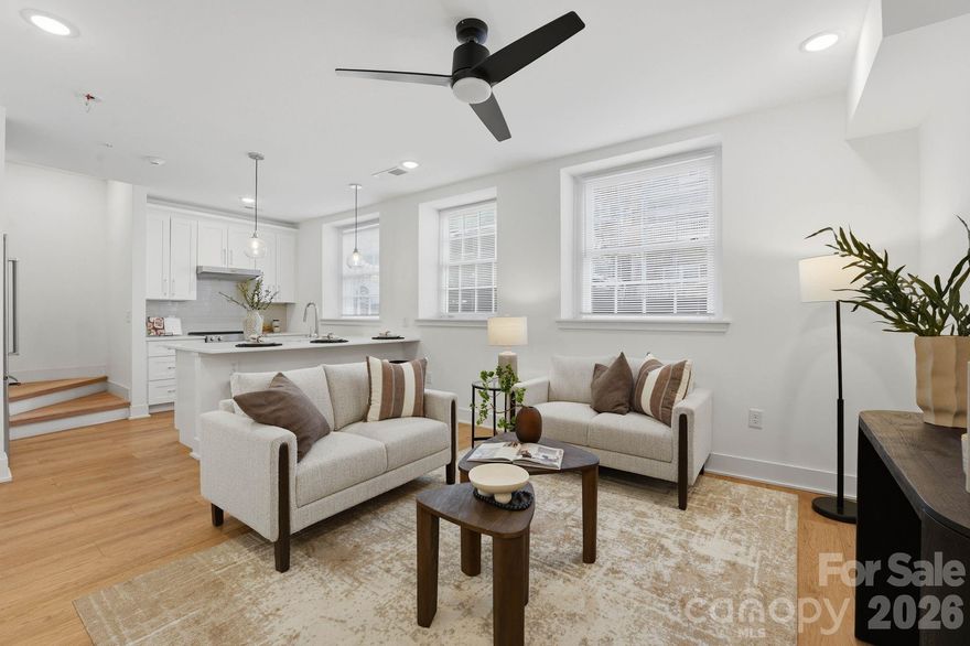 A rare opportunity to own a piece of Charlotte history — thoughtfully reimagined for modern, lock-and-leave living. Located within The Arches, a boutique collection of residences set inside a restored 1927 church in the heart of Wesley Heights, this luxury townhome-style condo offers a distinctive blend of historic architecture, modern functionality, and urban convenience. Originally built as a neighborhood church and place of gathering, the building has been carefully transformed while preserving its historic integrity, timeless presence, and architectural character. Each residence offers a private entrance, giving the home a sense of individuality and privacy rarely found in condo living. Inside, the main living area feels bright, open, and inviting, with warm wood flooring, fresh neutral interiors, recessed lighting, modern ceiling fans, and abundant natural light. The open-concept layout flows seamlessly from the living area into the kitchen, creating an easy everyday living and entertaining experience. The kitchen is beautifully appointed with white cabinetry, quartz countertops, stainless steel appliances, a tile backsplash, pendant lighting, and an oversized island with seating. Spa-inspired baths feature porcelain tile shower walls and floors, modern fixtures, and clean, elevated finishes. The private rooftop terrace is one of the home’s standout features, offering the perfect place to unwind, entertain, and take in Uptown Charlotte views and evening city lights. Additional highlights include an assigned on-site parking space deeded with the unit, thoughtful modern finishes throughout, and the unique character of a historic adaptive reuse property. Ideally located minutes from Uptown Charlotte, South End, I-77, greenway access, parks, breweries, coffee shops, restaurants, and neighborhood favorites throughout Wesley Heights, The Arches offers a rare blend of history, design, and lifestyle in one of Charlotte’s most connected urban neighborhoods.