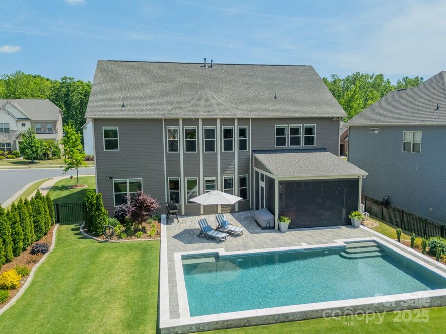 VIDEO TOUR! Visit www.1107CastleRd.info - Experience elevated living in this luxury oasis. Nestled in the highly sought-after Indian Land area, this exquisite home spans 3,800+ sqft, 5BD/4BA, an office, & a bonus room. The main level offers a guest suite w/ a full bath, ideal for extended family & guests. Step outside to your resort-style retreat w/ a heated saltwater pool, pristine landscaping, privacy trees, & screened-in porch w/ automated retractable screen—perfect for seamless indoor/outdoor living. The gourmet kitchen is outfitted w/ premium ss appliances & wine fridge. Additional upgrades include a whole-home water filtration system, business-grade WiFi network, & extended parking pad. The washer, dryer, & pool equipment are included at no additional cost. Enjoy access to top-rated schools, Publix, Indian Land Rec Center, Target & Costco (late 2025). This rare opportunity to own in one of the area's fastest-growing spots won’t last. Schedule your private tour now!