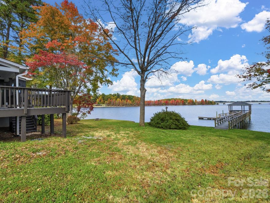 Endless VIEWS! NO HOA! LOCATION! Wake up every morning to breathtaking sunrises and panoramic water views from this 5 bedroom 4 bath home that sets the tone for your day. This nearly new, modern-designed home was thoughtfully crafted to maximize its stunning waterfront view from almost every room. The open-concept layout features soaring windows, flooding the interiors with natural light. The architecturally designed split floor plan includes two primary suites on the main level, each with a private entrance — ideal for a multi-generational setup, in-law suite, AirBnB, or both! Recent upgrades (2022): luxury plank flooring, carpeting, windows, doors, roof,  Dual HVACs with 2 zones area new in 2022, energy efficient appliances, interior/exterior paint, and a spacious deck. The gourmet kitchen boasts quartz countertops, modern cabinetry, and premium fixtures, while all bathrooms have been tastefully renovated. A versatile upstairs flex room is perfect for a home office, media room, or guest space. Step outside to your expansive deck and soak in unobstructed main-channel views of deep, year-round water — ideal for water sports, entertaining, or unwinding by the firepit as boats drift by. Your private pier with covered gazebo and boat slip provides direct lake access to popular “on-the-water” dining spots. 5 bedroom approved septic system installed 9/2024, new well 2024. Flexible design allows for future additions such as a 2-car garage or upper-level suite. An exciting Birkdale-style waterfront development is coming just moments away, further enhancing the area’s desirability and long-term value. please visit Catawba county planning for the midway marina project.  Plus, enjoy low county taxes and no HOA!