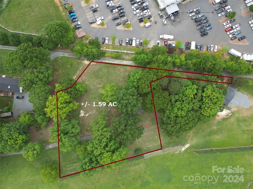 GREAT LOT ZONED LIGHT INDUSTRIAL JUST OFF HWY 74.  PROPERTY IS CLEARED AND HAS SEPTIC AND WELL.  PUBLIC WATER AND SEWER AVAILABLE.  SEE ATTACHED 2020 SURVEY AND ZONING INFORMATION.  LOTS OF POTENTIAL USES:  VETERINARIAN OFFICE, DOGGY DAY CARE, BUSINESS OFFICE, GAS STATION, SHOOTING RANGE, ECT.