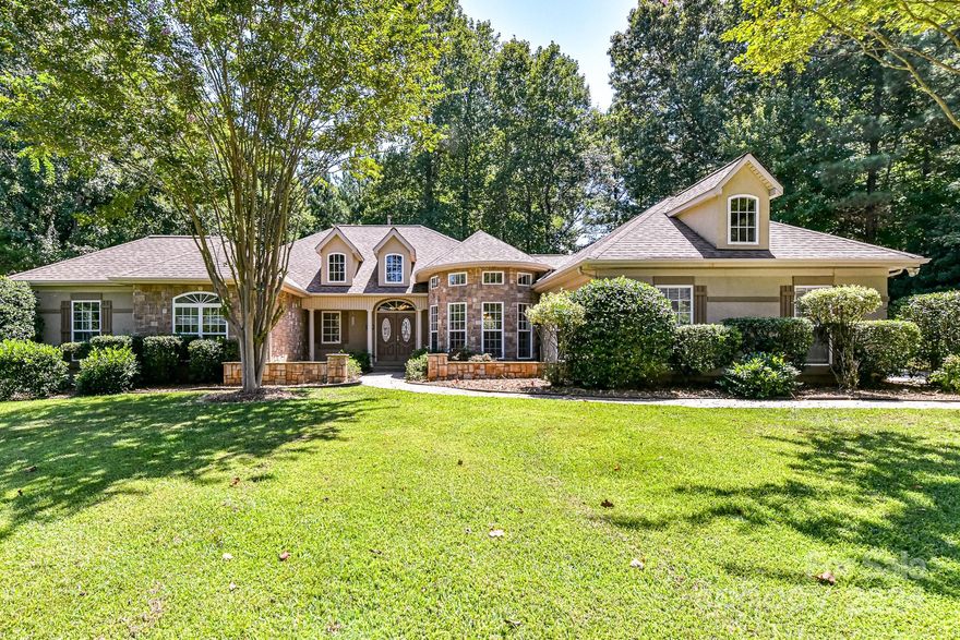 Hard-to-find stately ranch home on an acre, in the sought after Catawba Crest neighborhood of Lake Wylie! As you enter the home, you'll be greeted to soaring ceilings and the family room with a wall of built-ins and a gas fireplace, the kitchen featuring white cabinets, Corian counters, and double ovens. Custom touches adorn the home from the detailed trim work on the dining room ceiling to the extensive crown molding. Home features a huge screened in porch with access from the family room and the large primary bedroom. Fresh paint throughout and new carpets in the bedrooms. For all you RV lovers, come and park with access to water, sewer and electric hookups on the property and then check out the shed that also has electricity. Don't miss out on this one.