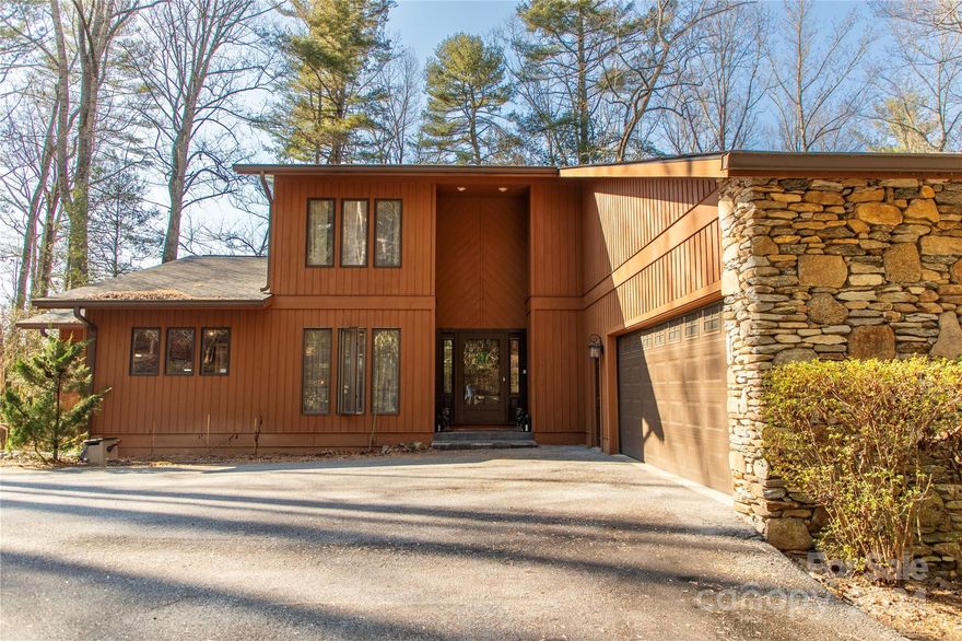 Large square footage home with cozy feel. Primary bedroom on the main level.  2 bedrooms, each with their own full bath, on the 2nd floor. Living room & family each have their own floor to ceiling fireplace w/ built in shelving, plus they both open to the large deck. Enjoy the beauty of the mountains in the screened room off the family room or relax on the large deck. Finished portion of the Basement has plenty of space to accommodate guests or large enough for in-law suite or 2nd Primary Bedroom, including a full Bath, a Walk-in Closet & built in Bookshelf with Wet Bar. Oversized 2 car garage. Whole house generator does not work & there was a leak from the water supply to refrigerator so flooring will need to be replaced in kitchen, there is wood rot around the patio doors on the main level. Upgrades include new roof 2022, water heater approx. 3 years old, exterior of home painted 3+ years ago.  Corner lot with natural landscaping and shade trees makes this a great place to call home.