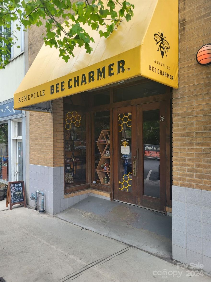 Stunning, 3-level concrete & steel, ~13,400 SF mixed-use building with two sidewalk level access
points located in the fabulously vibrant, highly walkable Grove Arcade downtown district among
Asheville's finest hotels, eateries and craft retailers! This multi, or easily convertible single
use property gem, is located immediately across the street from the historic Grove Arcade, Cambria
hotel, public parking garage & ~200' walk to the Federal building! Tenant mix includes: 2 retailers
on Battery Park, 1 retailer on Wall Street, 1 - 2nd floor luxury apartment w/ steel balcony
overlooking Wall St and one 3rd floor conjoined, compartmentalized live/work unit! See today!