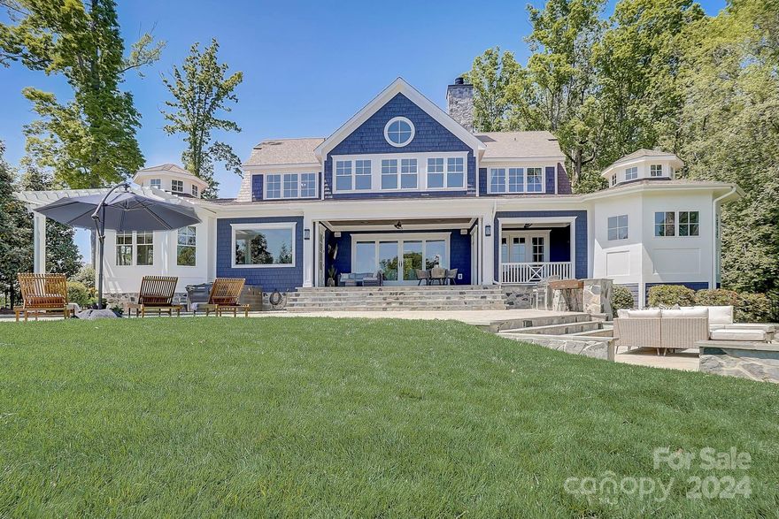 THIS WATERFRONT HOME HAS EVERYTHING. Custom-built by Patrick Joseph Distinctive Homes as a personal residence. Amazing 1.3-acre lot w/220’ of panoramic lake views. Amazing outdoor living -Saltwater pool, outdoor living room w/wood-burning fireplace, new outdoor kitchen, covered porches. Covered boat dock w/ boat lift, tandem jetski ports & kayak rack. Year-round lake access. Gourmet kitchen features massive island, farm sink, Thermador 6-burner gas stove, double ovens, dual dishwashers, built-in espresso machine & fridge, massive walk-in pantry w/2nd fridge & ice maker. Private guest suite over huge 3 car garage w/ kitchenette & full bathroom. Architectural details such as cupolas, coffered ceilings, custom hardwood floors & fixtures. Almost 500k spent on upgrades to make this a move-in ready home. New exterior & interior paint. New carpets. New synthetic 50 year warranty roof. Encapsulated crawlspace, lake-fed irrigation, low Iredell County taxes, no HOA & more! Convenient location.