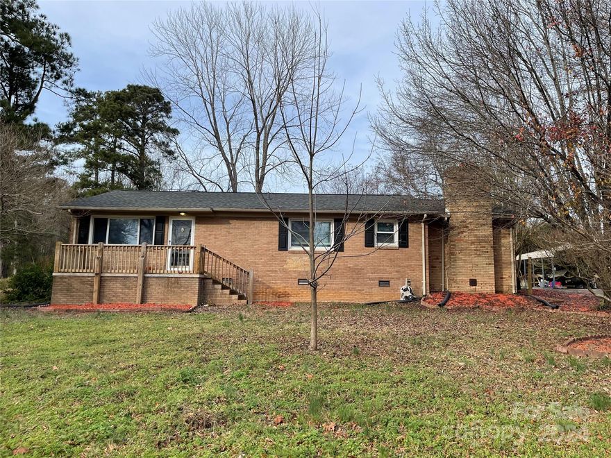 Ready to move in ranch in Buford school district on 1.816 acres. Home features family room with gas logs fireplace, formal living room, kitchen/dining combination, 3 bedrooms and 2 full baths, rear deck and detached double carport. Outside storage building to remain at no value.