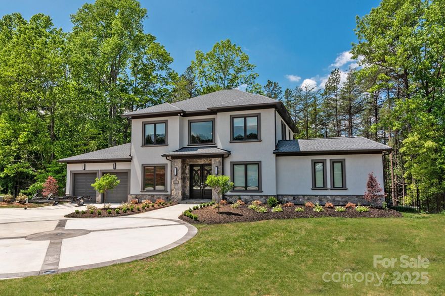 Exceptional opportunity to own a stunning lakefront home on Lake Norman! This beautifully designed residence is filled with natural light, beautiful views of the lake and outdoor luxury areas. The fenced backyard features a built-in pool and spa, complemented by a surround sound speaker system for the ultimate outdoor experience. Enjoy direct lake access with a privately owned dock, equipped to accommodate multiple boats and Jetskis. Entertain with ease at the outdoor grilling station, complete with a built-in island. The spacious primary suite offers his & her bathrooms and walk-in closets, along with a spa-inspired cave shower. Thoughtful conveniences include laundry rooms on both the main level and basement, oversized walk-in closets, and multiple food pantries throughout the home. A generously sized steam shower and full bath serve the pool and exercise room. Basement features a dedicated music room, that may serve as a flex space, featuring a stylish drop-down ceiling and sound-attenuating insulation. Additional sleeping arrangements include cleverly designed bunk areas, perfect for guests or family.

Modern touches like floating vanities and elegant tile flooring on the main level complete this one-of-a-kind lakeside retreat.