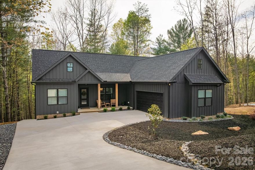 LIFE STYLE UPGRADE!  in The Coves Mountain River Club – Dual Living Spaces, 2.02 Acres on a quiet culdesac.
An exceptionally rare opportunity awaits in The Coves Mountain River Club, where craftsmanship, versatility, and mountain living converge. This 5-bedroom, 3-bath custom home sits on 2.02 acres with a peaceful creek along the rear, offering a private and tranquil setting.   Every detail, from flooring and lighting to layout and finishes, has been purposefully chosen to enhance comfort, beauty, and everyday living.
• • Completed in 2025, the main level features an open floor plan with vaulted ceilings, sophisticated lighting, and a neutral color palette, creating a bright, modern, and serene environment.  Charcoal cabinetry, quartz countertops, and stainless-steel appliances combine style with practical functionality in the kitchen.  
••The primary bedroom is a haven for relaxation and rest, with an extra-large soaking tub, walk-in shower, double vanities, and walk-in closet.
The septic system was upgraded to a 6 bedroom system and the lower level of the home was completed in March 2026.  It features a complete secondary living space with its own entrance.  The full kitchen, living room and flex area, 2 bedrooms, spare room with closet, full bath and generous storage provide flexibility for multigenerational living, guest quarters, an in-law suite, or a long-term income producing-opportunity.
Dual HVAC systems, a tankless water heater, an oversized 2-car garage with EV charging, and structural provisions for a future balcony or patio ensure modern convenience and ease throughout.  A deep, private water well with strong production adds to the property’s long-term reliability and self-sufficiency.  
This home and property combine privacy and space with natural elements, including a calming creek, hardwood trees and mountain laurel, amid a 3,200 acre gated community with unparalleled amenities. The crown jewel of The Coves is the amazing post and beam clubhouse, Pisgah Lodge, occupying one of the highest peaks, with 360° views of the Blue Ridge Mountains, South Mountains, and Brushy Mountains; you can see Mt. Mitchell, the highest peak east of the Mississippi, from the back deck. Also at the clubhouse: great room with vaulted ceilings and 3-sided fireplace, full kitchen, saline pool, fitness center, locker rooms, lending library, pool table, ping pong, porches and decks with rockers, and fire-rings! Dark Sky community protocols preserve the night sky providing amazing stargazing and protecting migrating birds, nocturnal animals, and insects that rely on natural darkness to navigate and hunt. Hike, bike, ride horses or UTVs on the private community trail system.  There are 5 miles of the Johns River on site with kayak access points and picnic areas.  Additional amenities include 2 equestrian centers, a community garden and vineyard, a dog park and pickleball courts.  30+ clubs planned activities and excursions.  500,000 acre Pisgah National Forest and the Wilson Creek Wild and Scenic River area are just outside the gates. Minutes to Blowing Rock NC, Lenoir NC, Morganton NC, and the Blue Ridge Pkwy. 1.25 hour to Charlotte NC or Asheville NC.