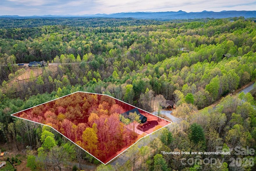 LIFE STYLE UPGRADE!  in The Coves Mountain River Club – Dual Living Spaces, 2.02 Acres on a quiet culdesac.
An exceptionally rare opportunity awaits in The Coves Mountain River Club, where craftsmanship, versatility, and mountain living converge. This 5-bedroom, 3-bath custom home sits on 2.02 acres with a peaceful creek along the rear, offering a private and tranquil setting.   Every detail, from flooring and lighting to layout and finishes, has been purposefully chosen to enhance comfort, beauty, and everyday living.
• • Completed in 2025, the main level features an open floor plan with vaulted ceilings, sophisticated lighting, and a neutral color palette, creating a bright, modern, and serene environment.  Charcoal cabinetry, quartz countertops, and stainless-steel appliances combine style with practical functionality in the kitchen.  
••The primary bedroom is a haven for relaxation and rest, with an extra-large soaking tub, walk-in shower, double vanities, and walk-in closet.
The septic system was upgraded to a 6 bedroom system and the lower level of the home was completed in March 2026.  It features a complete secondary living space with its own entrance.  The full kitchen, living room and flex area, 2 bedrooms, spare room with closet, full bath and generous storage provide flexibility for multigenerational living, guest quarters, an in-law suite, or a long-term income producing-opportunity.
Dual HVAC systems, a tankless water heater, an oversized 2-car garage with EV charging, and structural provisions for a future balcony or patio ensure modern convenience and ease throughout.  A deep, private water well with strong production adds to the property’s long-term reliability and self-sufficiency.  
This home and property combine privacy and space with natural elements, including a calming creek, hardwood trees and mountain laurel, amid a 3,200 acre gated community with unparalleled amenities. The crown jewel of The Coves is the amazing post and beam clubhouse, Pisgah Lodge, occupying one of the highest peaks, with 360° views of the Blue Ridge Mountains, South Mountains, and Brushy Mountains; you can see Mt. Mitchell, the highest peak east of the Mississippi, from the back deck. Also at the clubhouse: great room with vaulted ceilings and 3-sided fireplace, full kitchen, saline pool, fitness center, locker rooms, lending library, pool table, ping pong, porches and decks with rockers, and fire-rings! Dark Sky community protocols preserve the night sky providing amazing stargazing and protecting migrating birds, nocturnal animals, and insects that rely on natural darkness to navigate and hunt. Hike, bike, ride horses or UTVs on the private community trail system.  There are 5 miles of the Johns River on site with kayak access points and picnic areas.  Additional amenities include 2 equestrian centers, a community garden and vineyard, a dog park and pickleball courts.  30+ clubs planned activities and excursions.  500,000 acre Pisgah National Forest and the Wilson Creek Wild and Scenic River area are just outside the gates. Minutes to Blowing Rock NC, Lenoir NC, Morganton NC, and the Blue Ridge Pkwy. 1.25 hour to Charlotte NC or Asheville NC.
