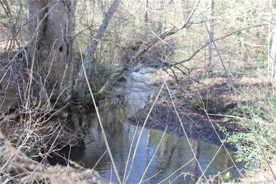 RARE prime Union Grove land for sale! Over 7 GORGEOUS acres with Creek! Mostly cleared with beautiful oak trees scattered throughout! Flowing Creek at back of property! Minutes to I 77! Builders dream! Partially fenced & gated. Bring your animals!