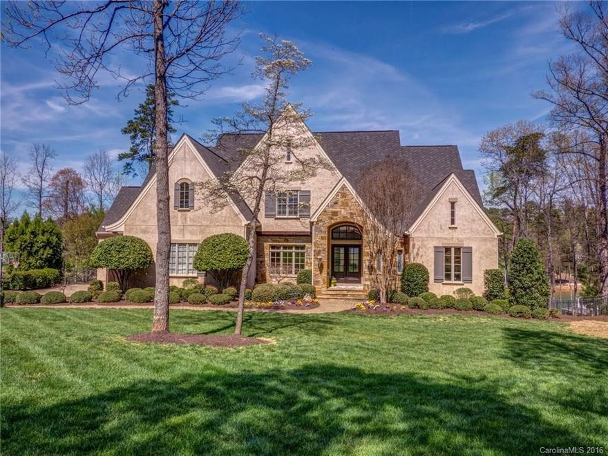 WF living & contemporary styling w/open floorplan for today's lifestyle at TNGC in The Point. Ultimate chef's kitchen w/ plenty of room to gather/entertain open to Great Room boasting views of the lake & master on the main. Upstairs hosts 3 lg bedrooms & 3 baths plus lg bonus room. Walkout lower level offers 2nd kit/bar billiards, cozy family room & unfin rec room. Step outside to an outdoor oasis w/custom in-ground pool/slide & Travertine pool deck or take the boat from priv pier to access LKN.