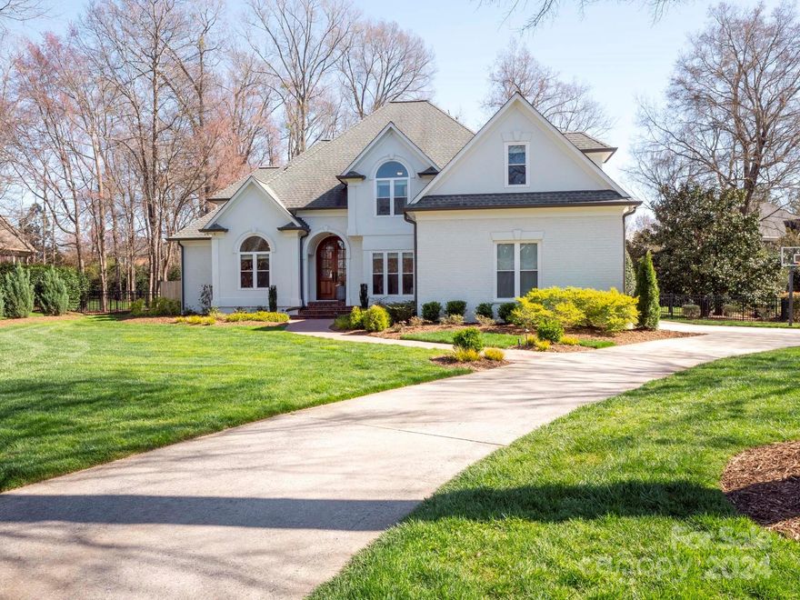 Indulge in the epitome of luxury living within the prestigious Providence Country Club! This custom home boasts opulent design elements such as soaring ceilings, hardwood floors, & exquisite moldings. The updated kitchen features pristine white cabinets, top-of-the-line stainless steel appliances, & resplendent granite countertops adorning a sprawling island, providing the perfect backdrop for culinary delights & social gatherings. A two-story stone fireplace graces the Great Room, while the main level offers a luxurious master suite & versatile living spaces. Upstairs, discover three spacious bedrooms, two full bathrooms, a bonus room converted into a theatre room extraordinaire featuring a perforated silver screen with Sony Atmos speaker system (just like the theaters) & a $12,000 Sony laser projector! Situated on a full acre lot, outside you'll find an inviting inground pool, picturesque stone patios, a soothing water feature & a fenced yard perfect for outdoor living/entertainment!