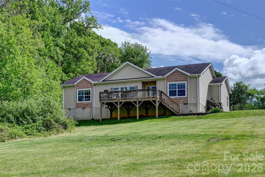 Located at 371 Starnes Cove Rd in Candler, NC, this 3-bedroom, 2-bath home sits on a spacious 0.65-acre lot featuring a fenced-in backyard in a private setting with peaceful front porch views. Inside, you’ll find 9-foot ceilings and an open-concept layout that creates a bright and inviting living space. Conveniently located just 5 miles from downtown Asheville and minutes from restaurants and shopping, this home offers the perfect balance of privacy and accessibility. An excellent opportunity for a first-time homebuyer or anyone seeking a move-in-ready home in a desirable location.