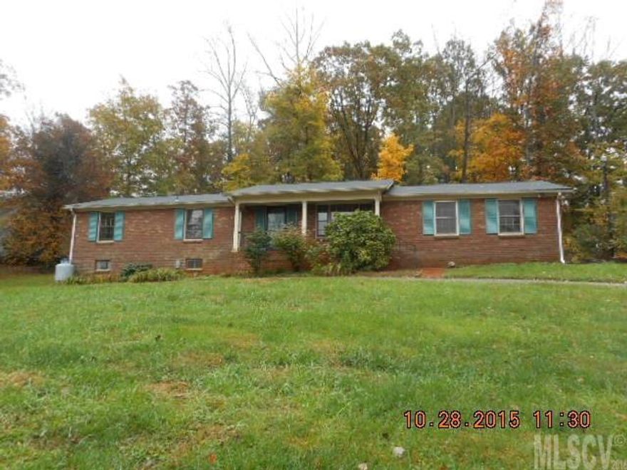 Brick ranch with 3 bedrooms, 2.5 baths, full basement, and double garage, situated on a corner lot in established subdivision just outside Morganton city limits. Basement is finished, but ceilings are below 7 feet, therefore it is not counted in total heated square footage. Property was built prior to 1978 and lead-based paint potentially exists.