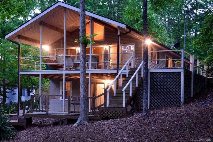 Affordable weekend retreat. This 2-bedroom waterfront is ready for you to move in! Open living room with vaulted ceiling, large covered deck and large patio for outside entertaining. Family room in basement. Covered boathouse with storage. Priced to sell!!